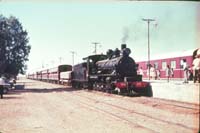 'a_a0339 - 1964 - Central Australia Railway NM 25 on Ghan at Marree for Australian Railway Historical Society Sundowner trip'
