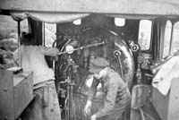 'a_h060 - circa 1930 - Central Australia Railway Cab of NM engine showing driver and fireman'