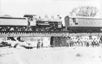 2.1930,North of Hawker possibly Finke River - Work train - NH4 bogie brake van + NM16