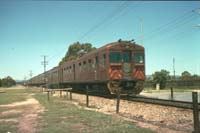 1.1.1989 Grange station nine car Red Hen 324 in lead