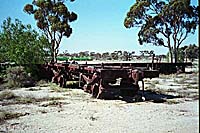 'ir_010303_03 - September 2001 - Photo taken at Parkeston. R 378 (still lettered as a G class wagon) "in the dirt" near the old Railway Institute building at Parkeston a couple of hundred metres from the main line. One obviously is R 378 but I couldn't determine the numbers of the other bogie wagon.'