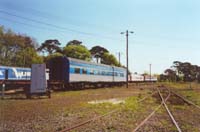 'pda_6085_05 - Saturday 21<sup>st</sup> October 2000 - A view from a distance of ex V&SAR Joint Stock twinette car <em>Nomuldi</em> (JTA1) at the West Coast Railway Ballarat East Workshops whilst undergoing restoration and a repaint into the West Coast livery.'