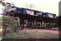 1300+1321 pulling a coal train across a trestle bridge (Photo:)